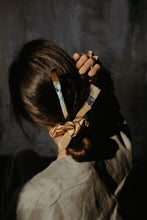 Load image into Gallery viewer, Artist girl by her canvas wearing gold silk scrunchie in her dark hair
