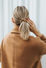Load image into Gallery viewer, Blond girl from the back with gold silk scrunchie in her ponytail
